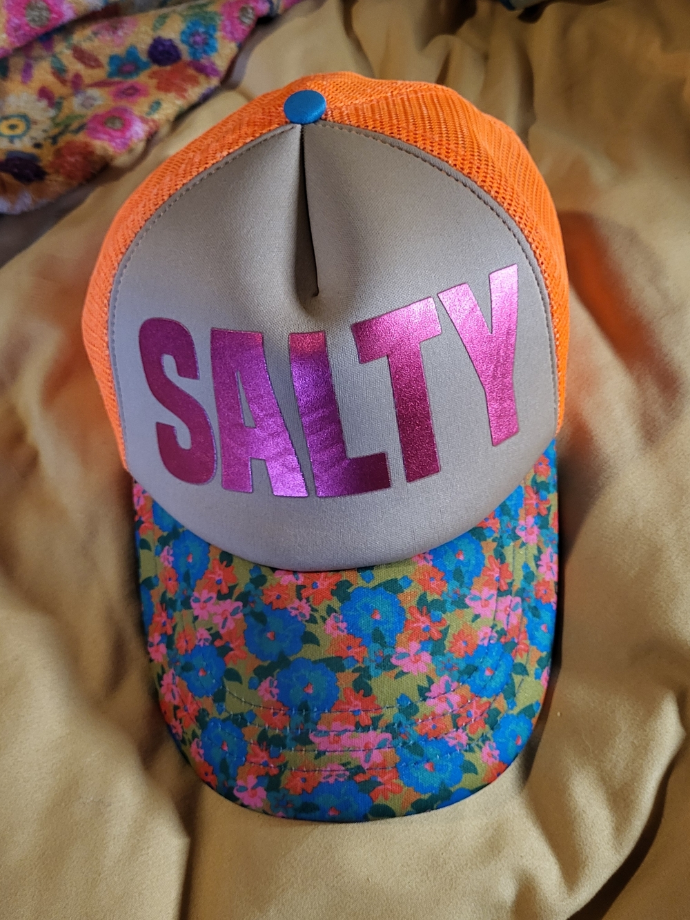 NATURAL LIFE Orange Mesh 'SALTY' Trucker Hat with Floral Brim